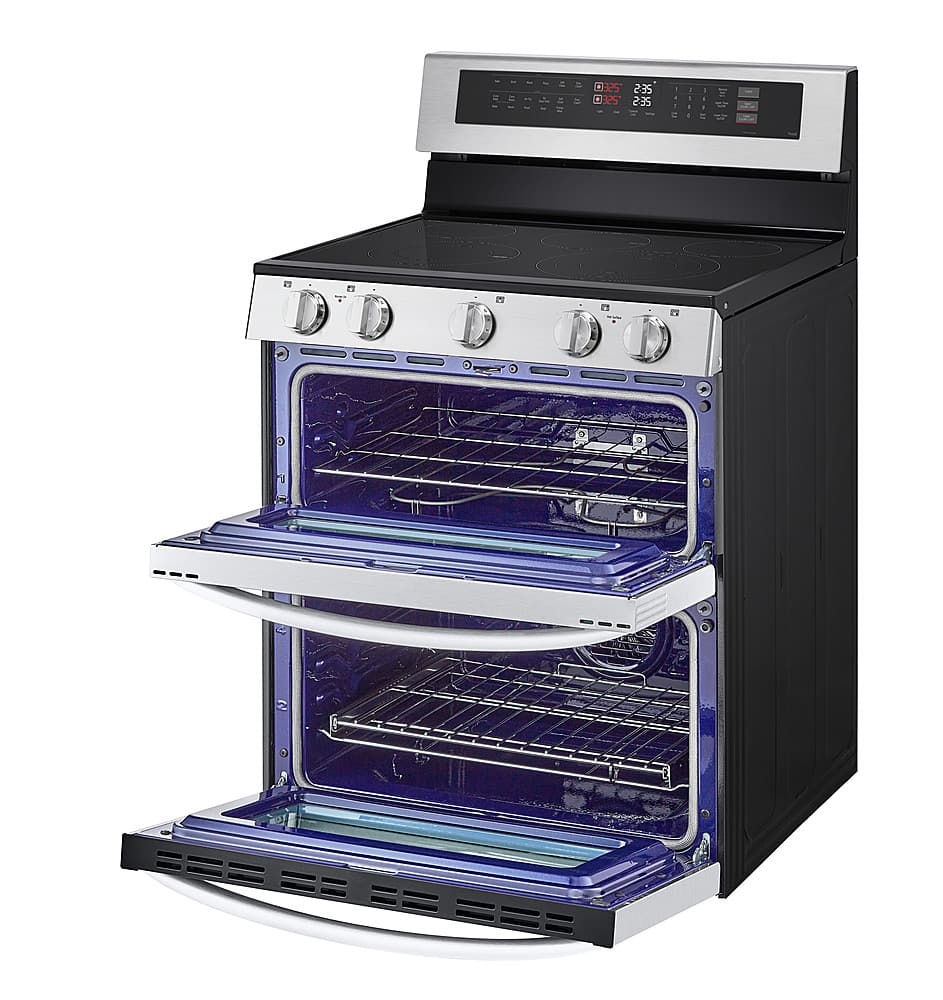 The image features a stainless steel oven with a blue interior. The oven has a digital display and a timer, making it a modern and functional appliance. The oven is open, revealing the blue interior and the racks inside. The oven is likely designed for efficient cooking and easy cleaning, making it a practical choice for any kitchen.