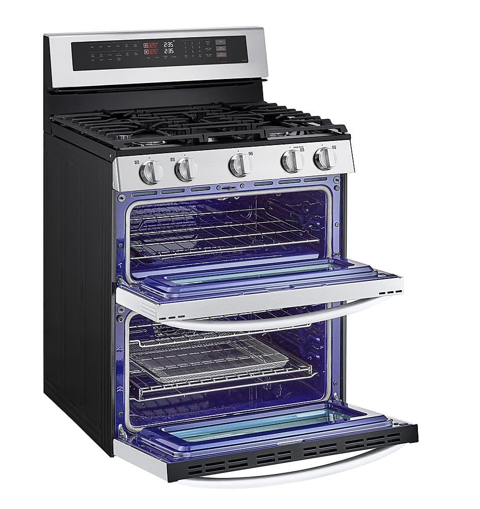 The image features a large, black and silver oven with a blue interior. The oven has a stove top and a stainless steel door. The oven is open, revealing the blue interior. The oven is likely a modern, high-quality appliance designed for efficient cooking and easy cleaning.