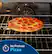 The image shows a pepperoni pizza sitting in a black oven, which is turned off. The pizza is placed on a rack, and there is no preheat required for this pizza. The oven is empty, and the pizza is ready to be cooked.