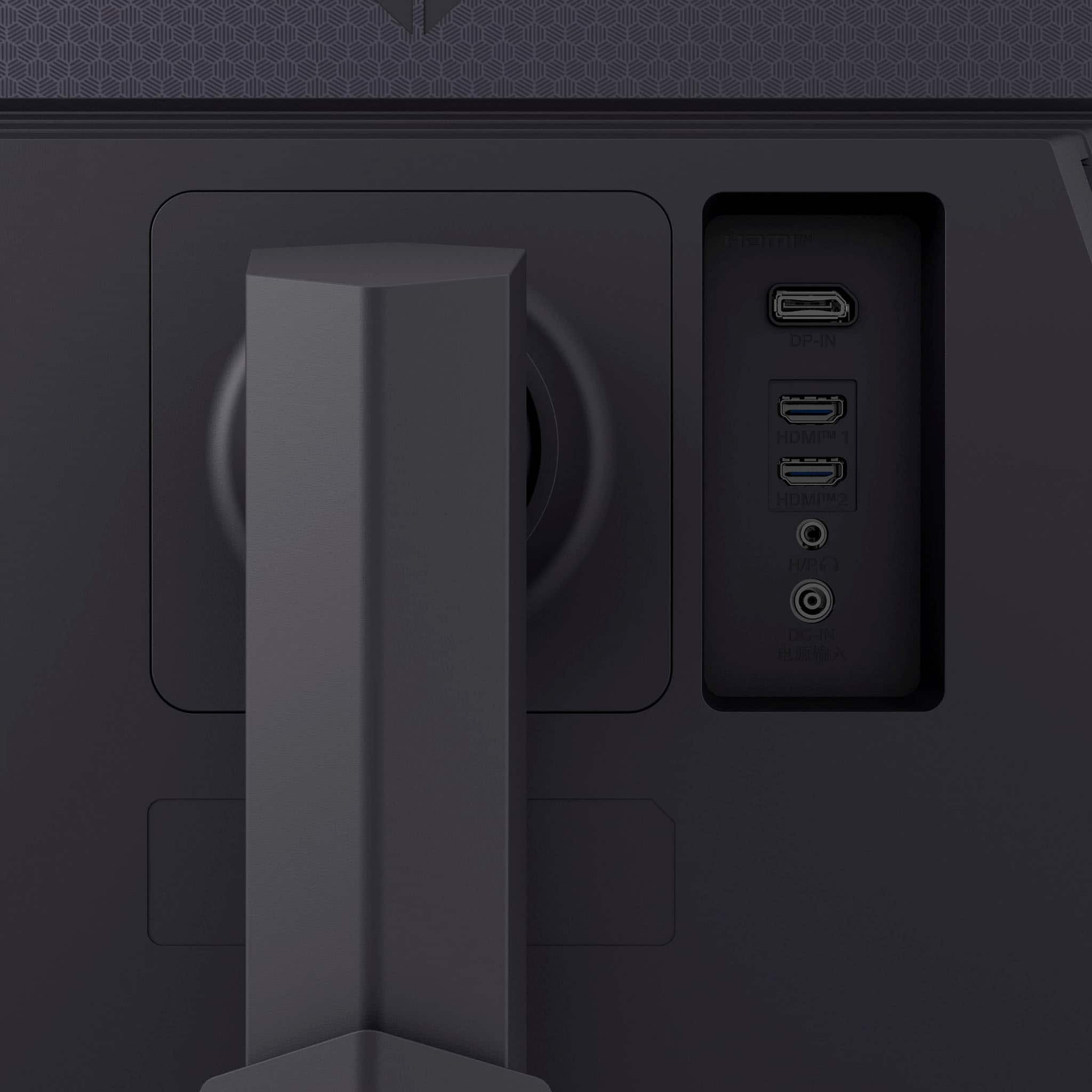 The image features a close-up of a black box with a USB port and a power outlet. The box has a small screen and a camera on it. The text "Haame DP-IN HDMI 1 HDMP H/PC DC-IN" is visible in the background, indicating that the box is likely a multimedia device or a computer accessory.