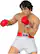 The image features a male figure, possibly a statue or a toy, wearing a white and red boxing outfit. He is holding his gloves up, possibly in a defensive stance. The figure is wearing a red belt and is positioned in a way that showcases his boxing attire.