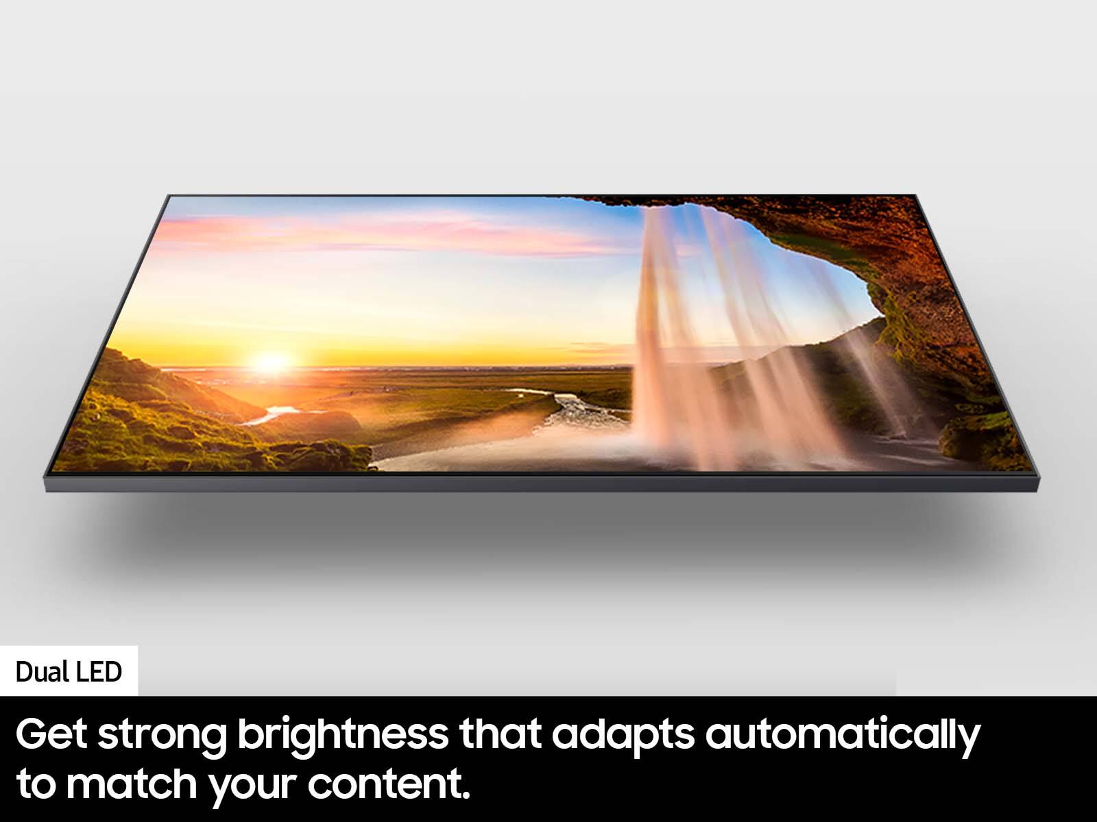 The image features a large flat screen television with a beautiful waterfall scene displayed on it. The television is described as a Dual LED, which provides strong brightness that adapts automatically to match the content being viewed. This technology ensures that the screen is always bright and clear, making it an ideal choice for those who want a high-quality viewing experience.