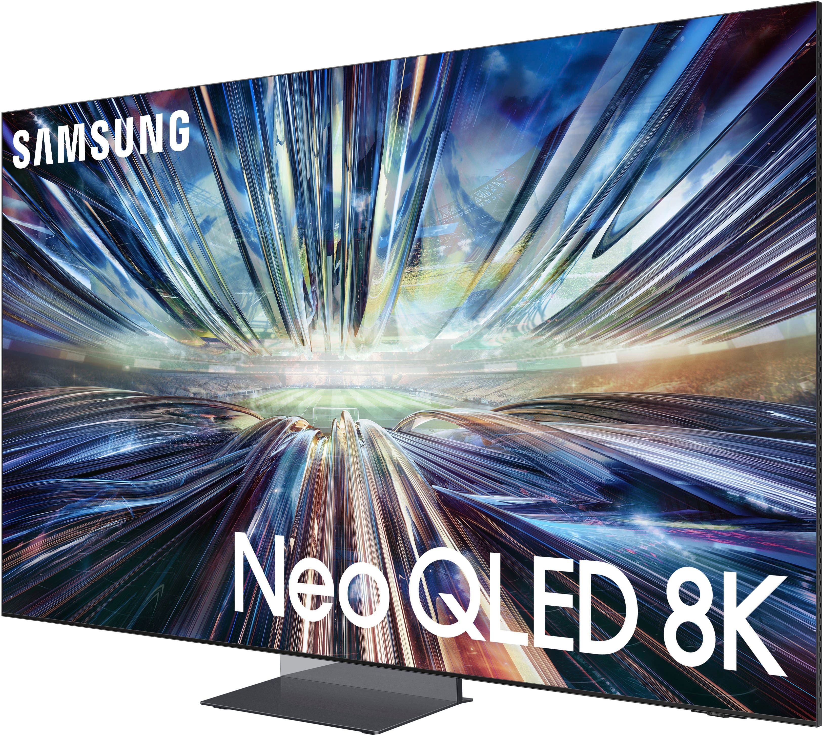 The image features a large Samsung Neo QLED 8K television screen. The screen is brightly lit and has a vibrant display, showcasing the high-quality resolution and technology of the TV. The Samsung logo is prominently displayed on the screen, emphasizing the brand and its commitment to providing top-notch visual experiences for its customers.