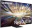 The image features a large Samsung Neo QLED 8K television screen, which is the main focus of the scene. The television screen is filled with a vibrant and colorful display, likely showcasing the capabilities of the 8K resolution. The screen is prominently placed in the center of the image, drawing attention to its impressive size and high-quality display.