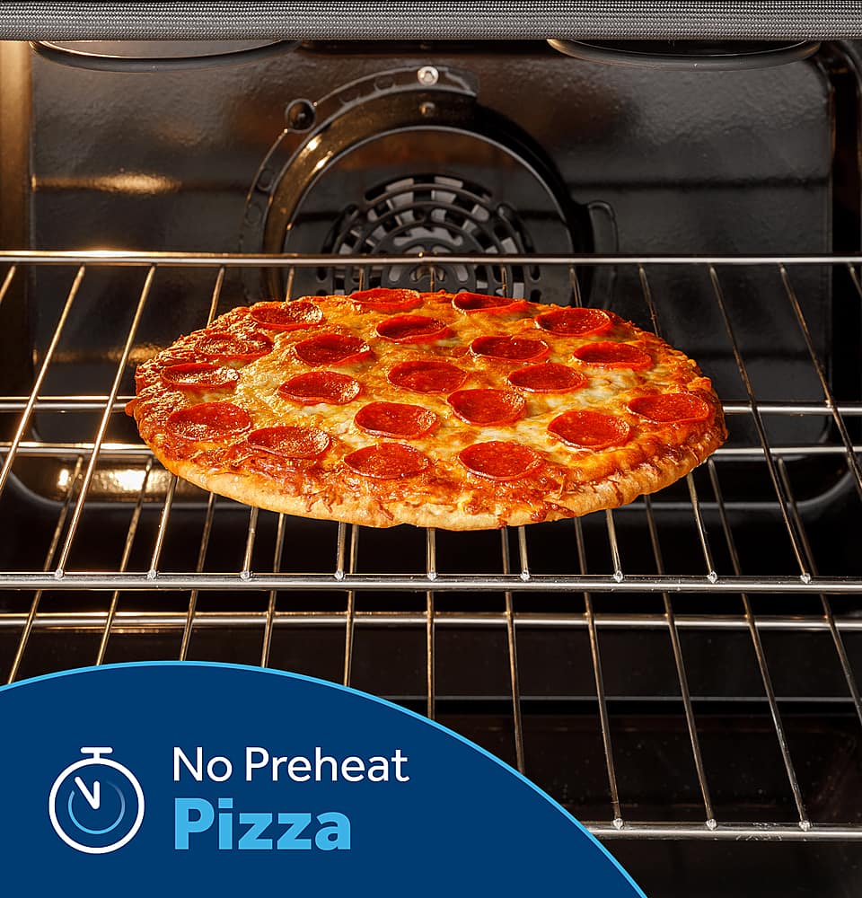 The image shows a pepperoni pizza sitting in a black oven, which is turned off. The pizza is placed on a rack, and there is no preheat required for this pizza. The oven is empty, and the pizza is ready to be cooked.