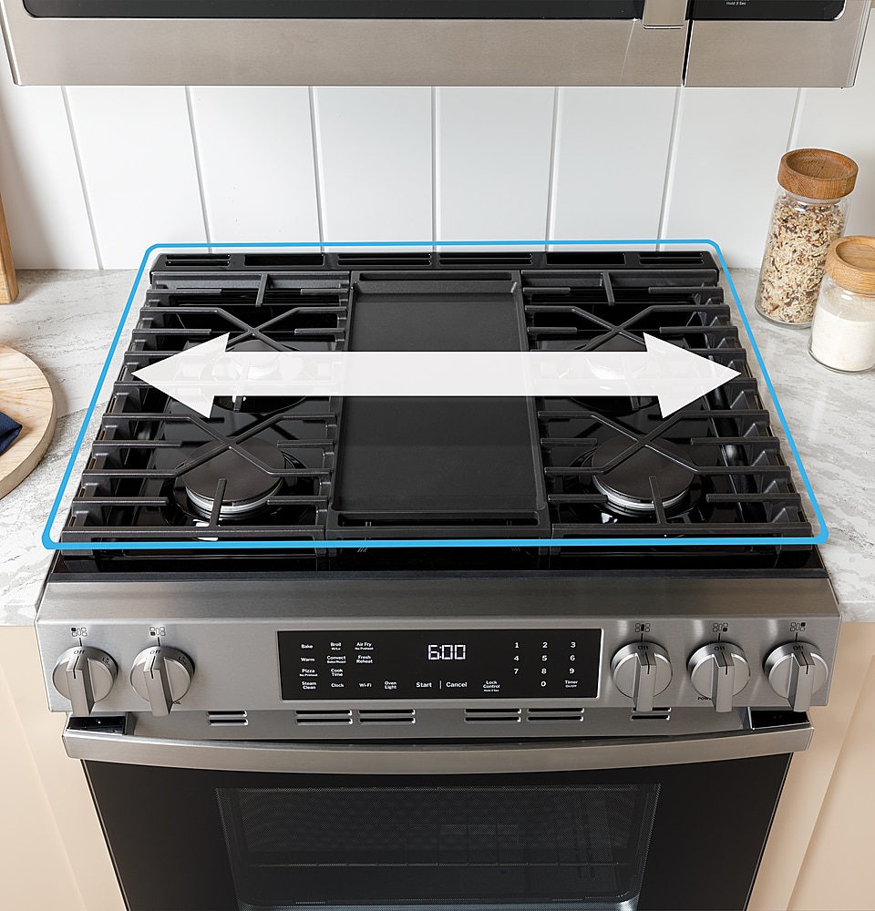 The image features a stove with a digital display showing the time of 6:00. The stove has a black top and a silver bottom. There is a white bowl on the countertop next to the stove.