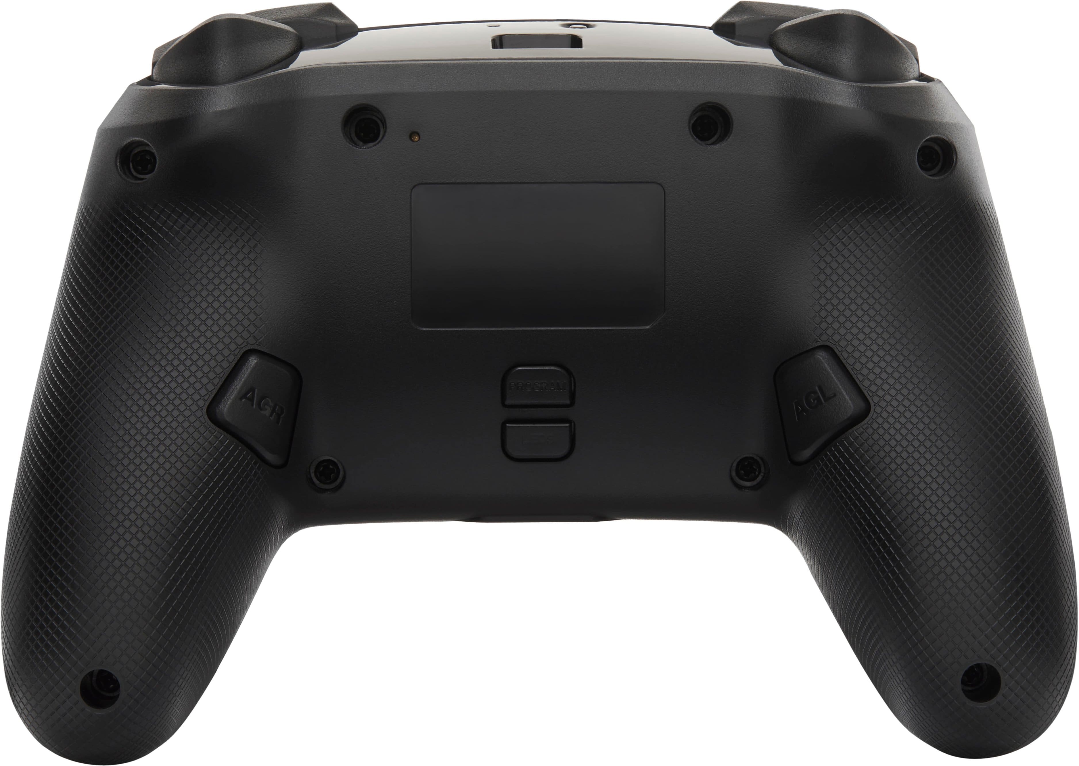 The image features a close-up view of a black game controller, specifically a PlayStation 4 controller. The controller is sitting on a white background, making it the main focus of the image. The controller has a sleek design and is likely used for playing video games on the PlayStation 4 gaming console.