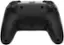 The image features a close-up view of a black game controller, specifically a PlayStation 4 controller. The controller is sitting on a white background, making it the main focus of the image. The controller has a sleek design and is likely used for playing video games on the PlayStation 4 gaming console.