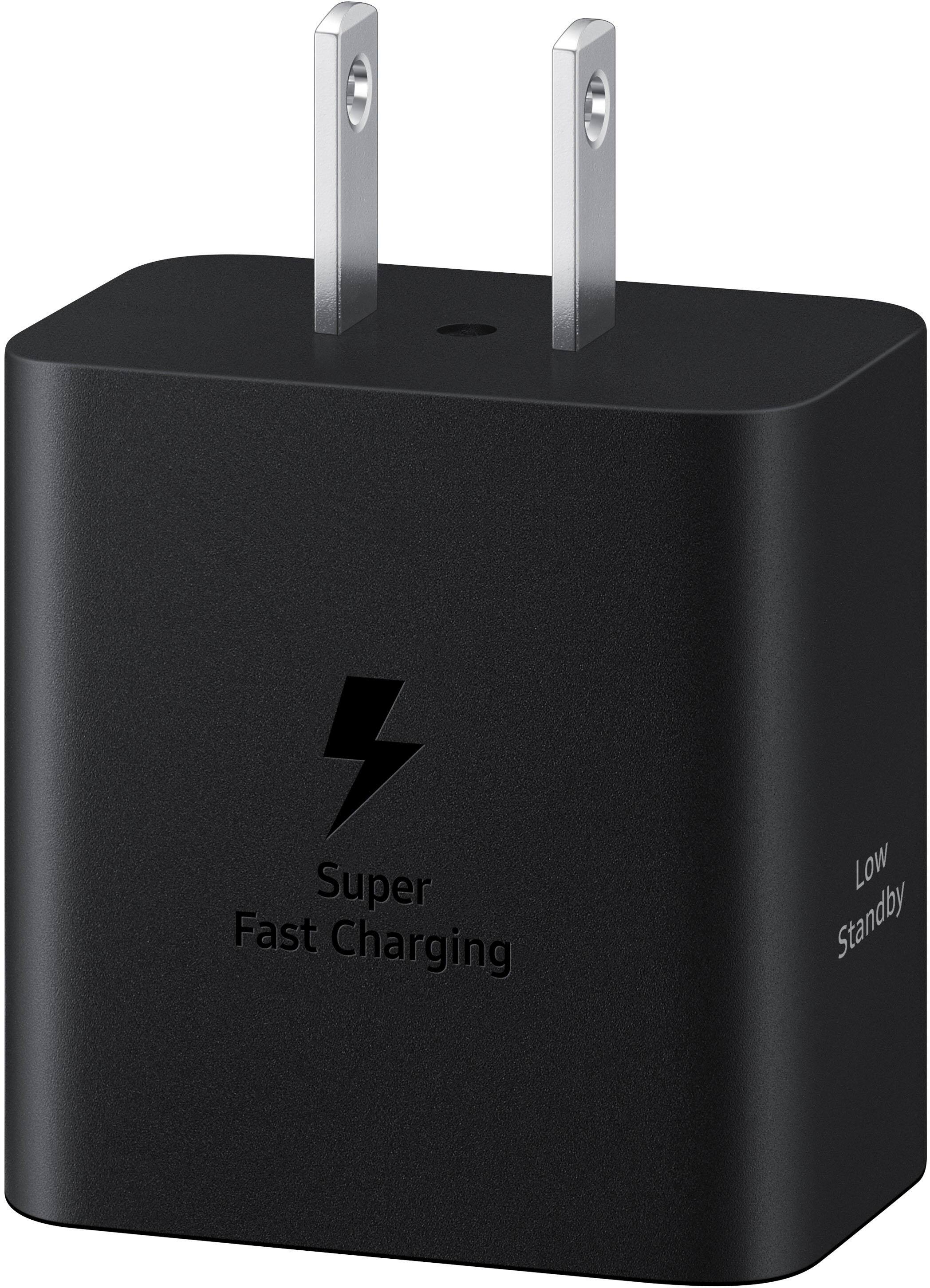 The image features a black charger with a white lightning bolt on it, indicating that it is a fast charger. The charger is designed to provide a quick and efficient charging experience for electronic devices. The charger is shown in a close-up view, highlighting its features and making it the main focus of the image.