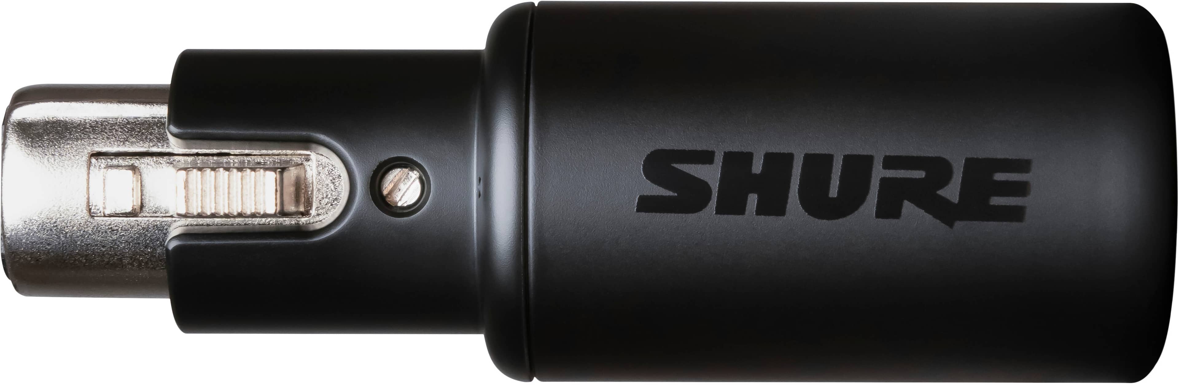 The image features a Shure MVX2U digital audio interface, which is an XLR to USB device. It is placed on a wooden desk, with a laptop nearby. The device is designed to provide a plug and play solution for digital audio, making it easy to use and connect with various audio equipment.