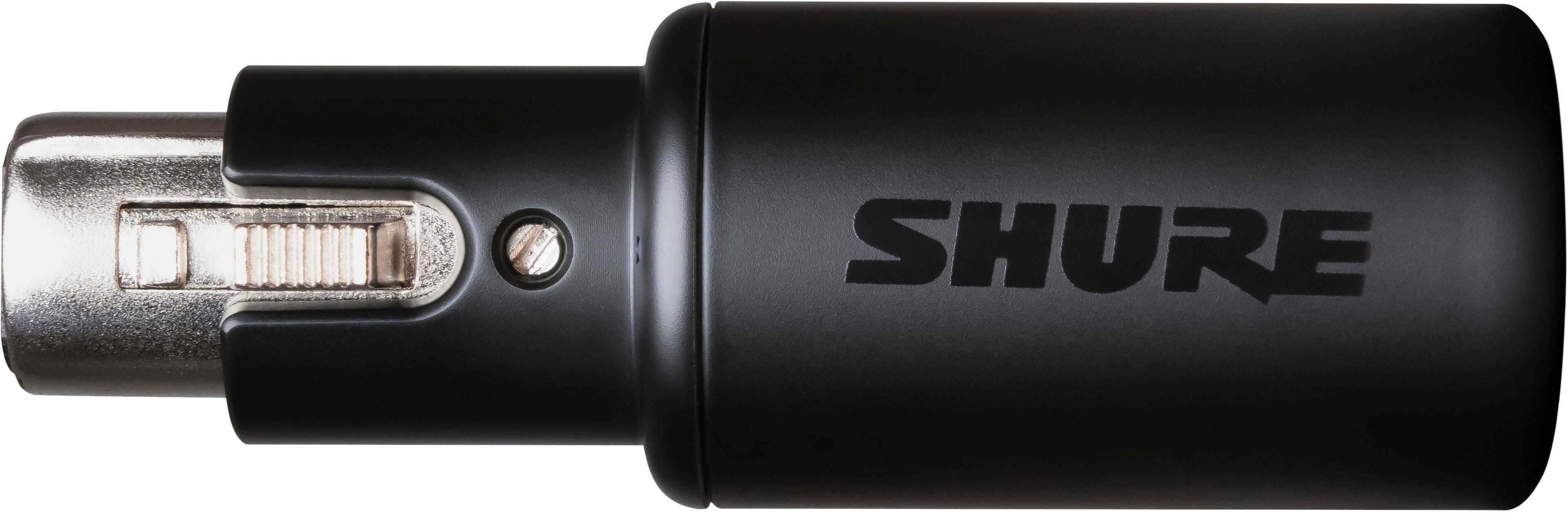 The image features a Shure MVX2U digital audio interface, which is an XLR to USB device. It is placed on a wooden desk, with a laptop nearby. The device is designed to provide a plug and play solution for digital audio, making it easy to use and connect with various audio equipment.