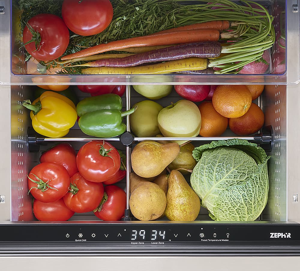 The image shows a variety of fruits and vegetables arranged in a refrigerator. The vegetables include carrots, oranges, and broccoli. The fruits include apples, oranges, and tomatoes. The refrigerator has a digital clock on the front, which displays the time as 39:34. The arrangement of the fruits and vegetables is organized in a way that allows for easy access and visibility.