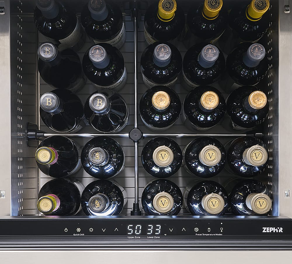 The image shows a wine rack with a total of 12 bottles of wine. The wine rack is divided into two sections, with 6 bottles in each section. The bottles are arranged in a neat and organized manner, with some bottles placed horizontally and others vertically. The wine rack is located in a wine cellar, which is designed to store and preserve wine at optimal temperatures and humidity levels. The wine cellar is equipped with a digital display that shows the current temperature and humidity levels, ensuring that the wine is stored in the best possible conditions.