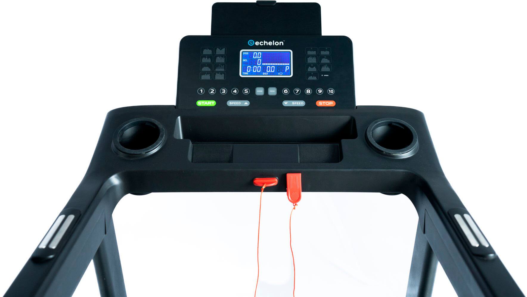 The image features a treadmill with a large screen displaying the word "Echelon" on it. The treadmill is designed for a full-body workout, providing a variety of exercises for the user. The screen also displays the current speed, which is set at zero. The treadmill is equipped with two speakers, one on each side, to enhance the user's workout experience with music or other audio content.