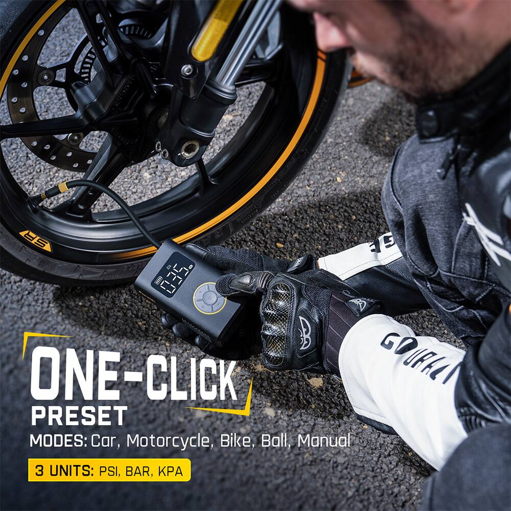 The image features a man working on a motorcycle, specifically focusing on the tire. The man is using a One-Click Preset device, which is designed to inflate tires quickly and efficiently. The device is placed on the tire, and the man is holding it in place while it inflates the tire. The One-Click Preset device offers multiple modes for inflating different types of tires, such as car, motorcycle, bike, ball, and manual. It is a convenient and efficient tool for maintaining tire pressure.