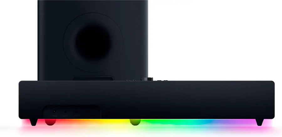 The image features a large black speaker with a rainbow light shining through it. The speaker is placed on a stand, and it appears to be a subwoofer head unit. The rainbow light adds a vibrant and colorful touch to the otherwise dark and sleek design of the speaker.