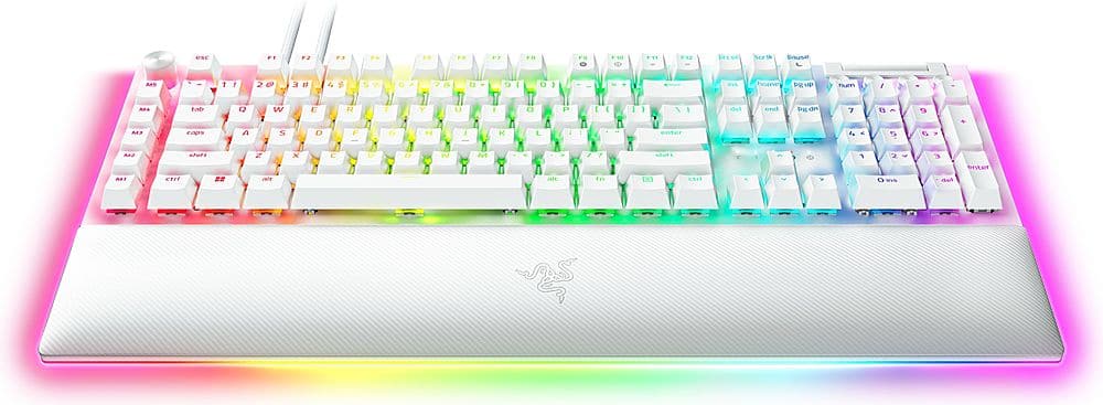 The image features a colorful keyboard with a rainbow theme. The keyboard has a white base and is adorned with a variety of colors, including pink, blue, green, yellow, and orange. The keys are arranged in a standard layout, with the letters and numbers spread across the keyboard. The keyboard is designed to be visually appealing and unique, making it a fun and eye-catching addition to any computer setup.