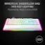 The image features a white and colorful keyboard with a rainbow-colored background. The keyboard is illuminated with a colorful glow, likely due to the presence of Razer Chroma RGB technology. The keyboard is designed with a unique and visually appealing aesthetic, making it an attractive choice for users who appreciate customizable and vibrant lighting effects.