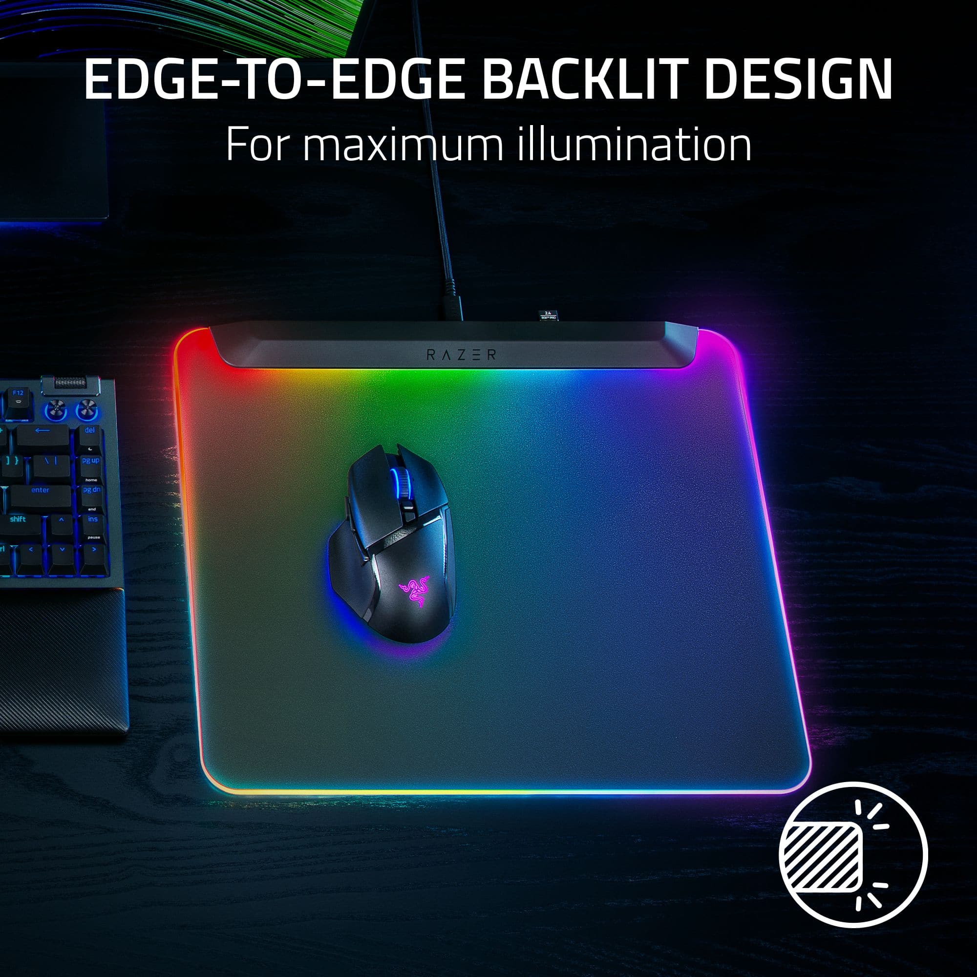 The image features a computer mouse and keyboard on a desk. The mouse is placed on a colorful mouse pad, which has a backlit design for maximum illumination. The keyboard is positioned next to the mouse pad, creating an appealing setup for computer users.