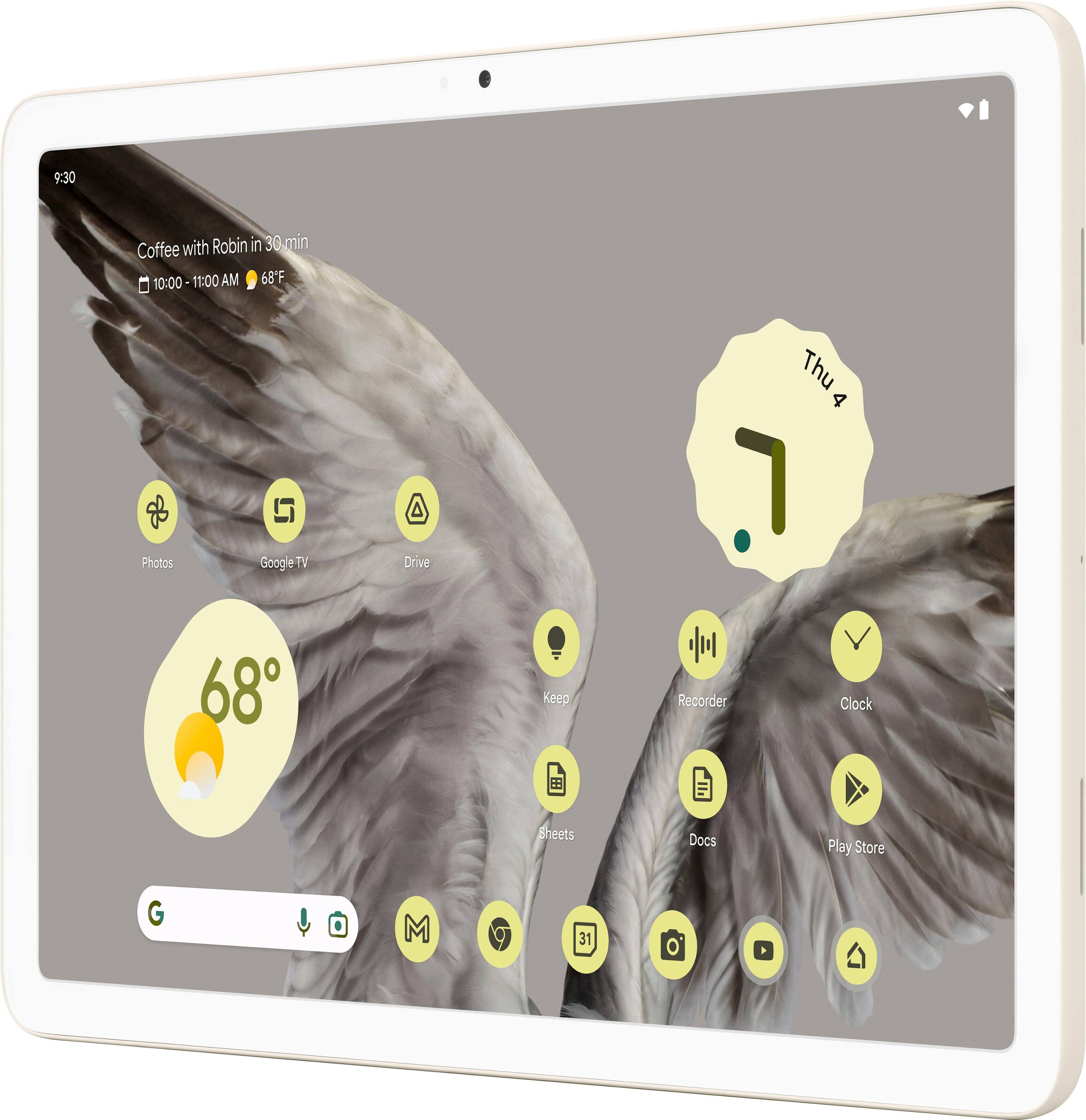 The image features a white tablet with a bird on it. The bird is positioned in the center of the screen, and there are several dots surrounding it. The tablet is open, and the bird appears to be the main focus of the image. The dots surrounding the bird might be related to some sort of game or application being used on the tablet.