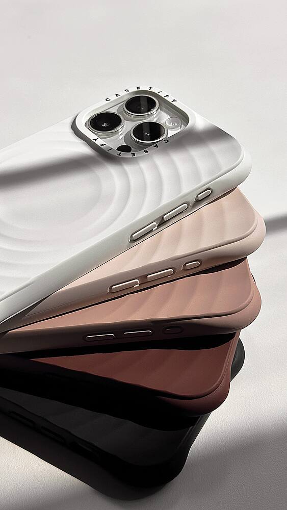 The image features a stack of four cell phones, each with a different color. The phones are placed on a white background, and their backs are visible, showcasing their unique designs. The colors of the phones are brown, pink, white, and black.