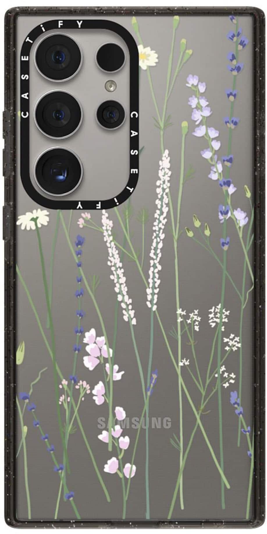 The image features a Samsung phone with a floral case. The case is decorated with purple flowers and green leaves, giving it a unique and attractive appearance. The phone itself has a black and white color scheme, which complements the vibrant colors of the case. The case is designed to protect the phone while also adding a touch of style and personality to the device.