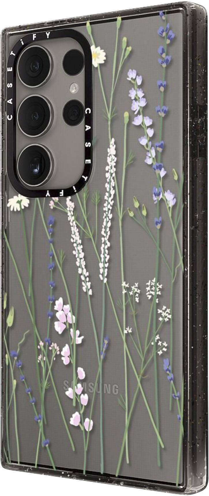 The image features a cell phone with a floral design on the back, which is made by Samsung. The phone has a black and white color scheme, and the case is adorned with flowers and plants. The design adds a touch of nature and visual appeal to the phone, making it stand out as a unique and stylish accessory.