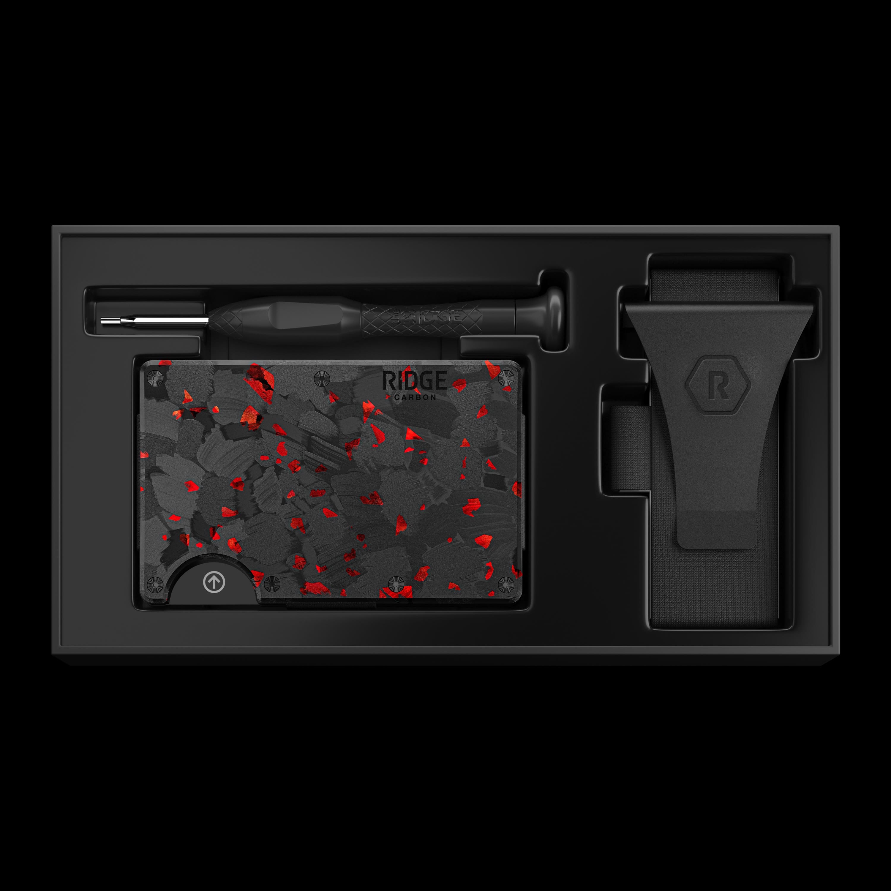 The image features a black wallet with a red design, which is placed inside a black box. The wallet is made of carbon fiber material, and it has a sleek and modern appearance. The box itself is also black, and it is designed to protect and store the wallet. The combination of the black wallet and the black box creates a visually appealing and sophisticated presentation.