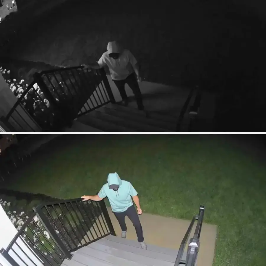 The image shows two people standing on a driveway in front of a house. They are positioned at the center of a green circle, which is a representation of a 30-foot radius. The house is located in a neighborhood with other houses nearby. There is also a car parked in the driveway, and a skateboard can be seen close to the people. The scene appears to be a playful or casual gathering of friends or family members.
