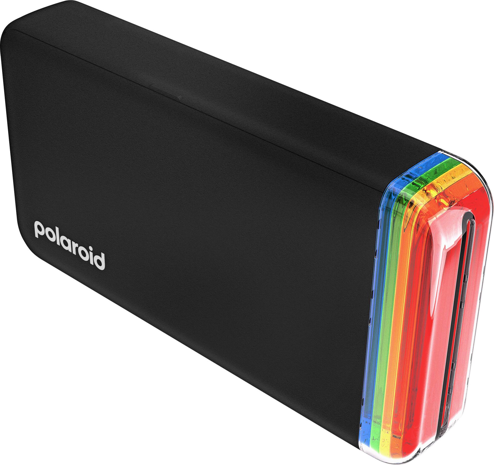 طابعة صور جيب Polaroid Hiprint الجيل الثاني 2X3 - أسود 1 بولارويد التقط/ي، اطبع/ي، انزع/ي، ألصق/ي: بهذه السهولة مع Polaroid Hi-Print 2X3 في طراز الجيل الثاني لدينا. طابعة صور جيب بتقنية Bluetooth® تحوّل لقطات هاتفك إلى مطبوعات عالية الجودة يمكنك نزعها ولصقها على أي شيء (وأي شخص) تُفضّل/ين. إنها طابعة الجيب التي يحتاجها خيالك. متوافقة فقط مع خرطوشة ورق Polaroid Hi·print 2X3 Gen 2. قرّب/ي على الجهة اليسرى. Polaroid - طابعة صور جيب Polaroid Hiprint الجيل الثاني 2X3 أسود - أسود.