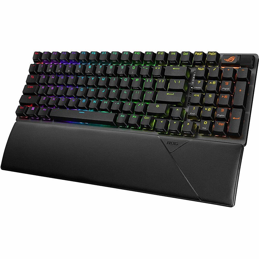 The text on the image is a description of the keyboard, which is a colorful, black, and white keyboard. The keyboard has a rainbow design and features a variety of colors, including red, green, blue, yellow, and orange. The keyboard is an ASUS keyboard, and it has a unique design that sets it apart from other keyboards. The keyboard is designed to be visually appealing and to provide a comfortable typing experience for users.