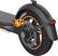 The image features a black wheel with orange accents and a silver hubcap. The wheel is attached to a black bike, and it has a unique design that includes a light on the back. The wheel is likely designed for a motorcycle or a specialized bicycle, as it is not a typical bicycle wheel. The wheel is also described as having a "fancy" appearance, which suggests that it is not a standard wheel but rather a custom or high-end design.