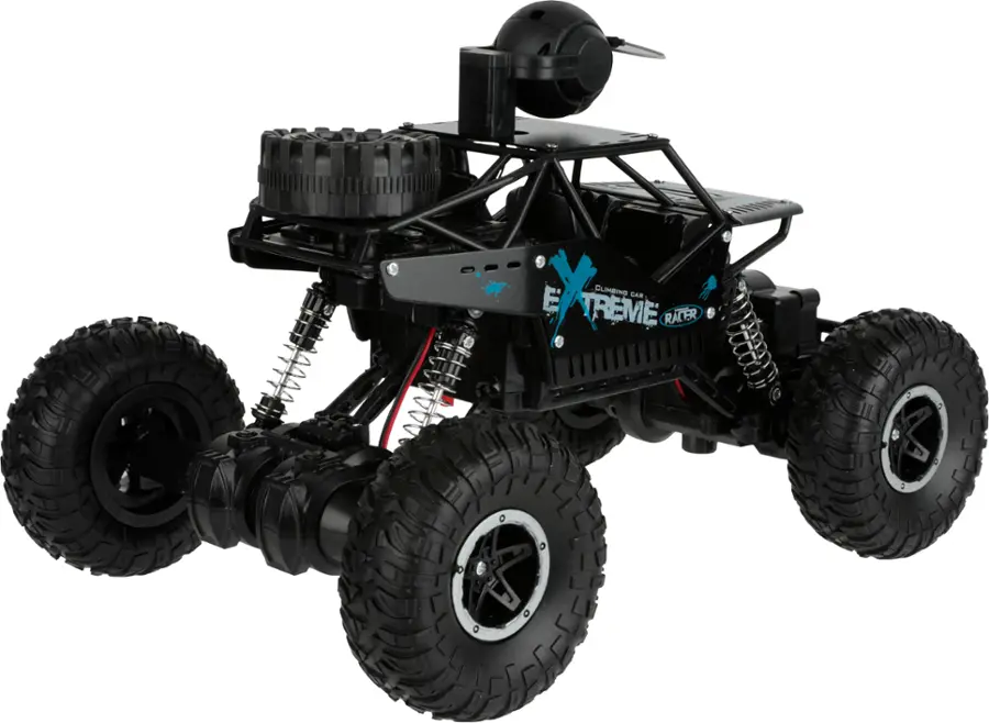 The image features a large, black, four-wheeled vehicle with a helmet on top, which is an extreme racer. The vehicle is designed for off-road racing and has a unique appearance, making it stand out from other vehicles. The helmet on top suggests that it is meant for safety and protection during the high-speed races.