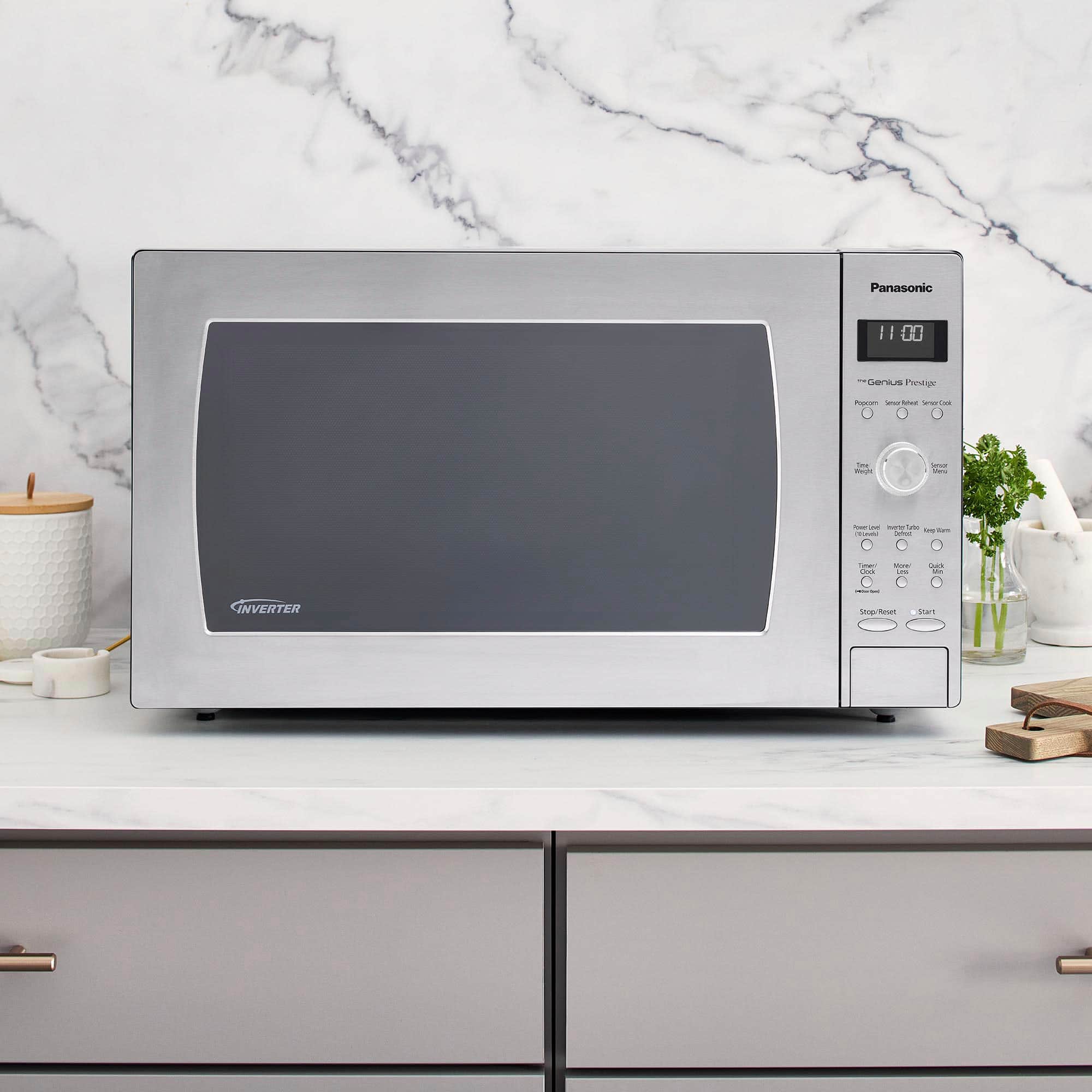 Panasonic microwave oven with a black door and silver body.