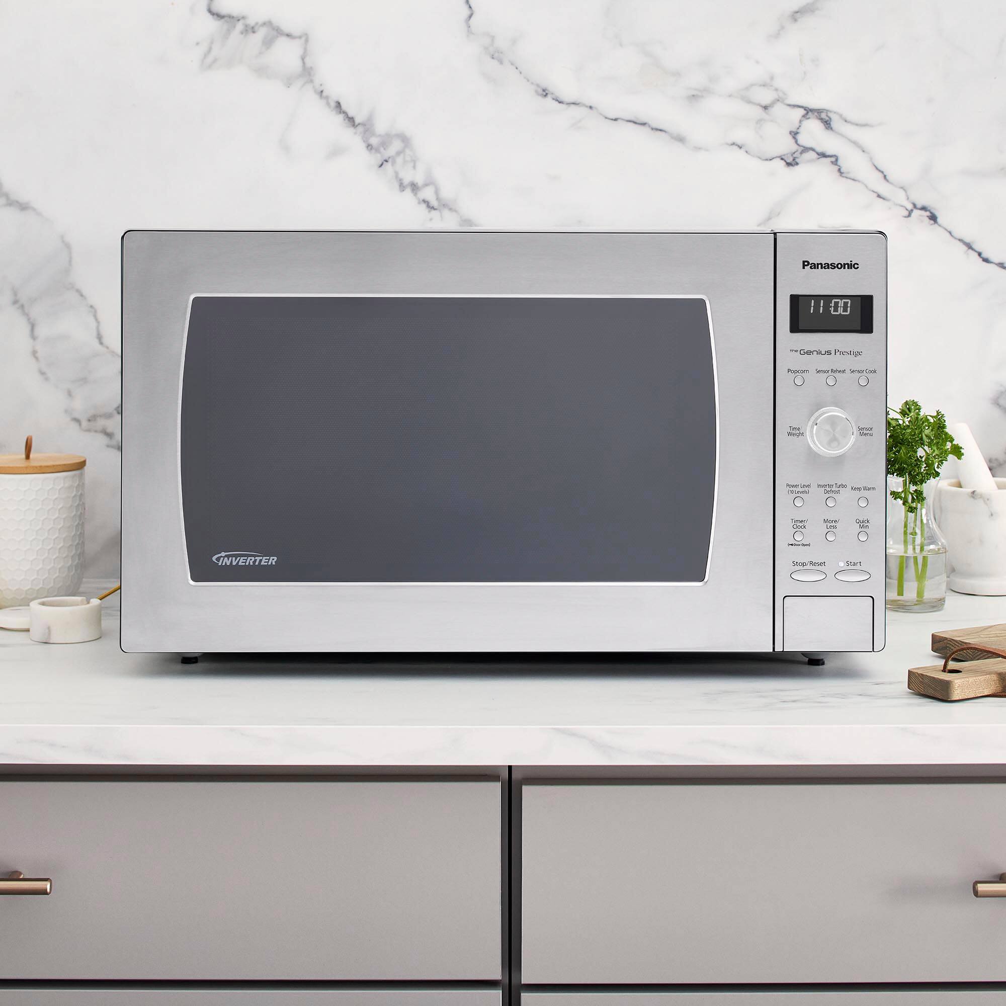 Panasonic microwave oven with a black door and silver body.