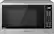 Panasonic microwave oven with a digital clock on the front.