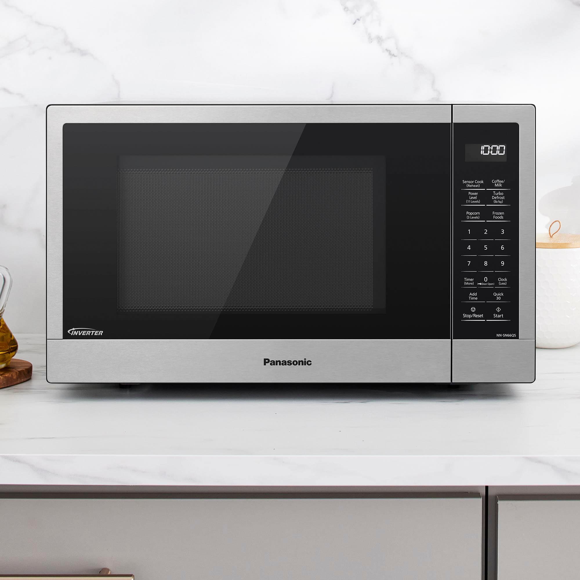 Panasonic microwave oven with a black and silver color scheme. The microwave is sitting on a countertop.