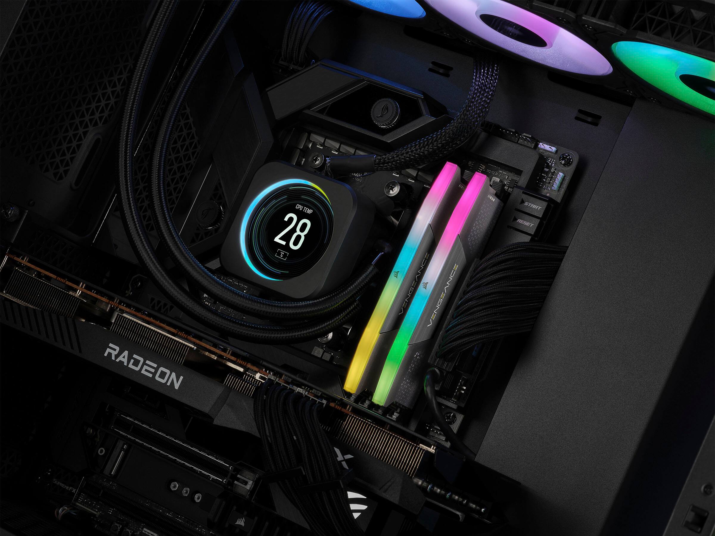 The image features a computer with a colorful and illuminated interior. The computer has a Radeon GPU, and the temperature is currently at 28 degrees Celsius. The inside of the computer is filled with various cords and wires, which are essential for its proper functioning. The illuminated components add a visually appealing touch to the computer's design.
