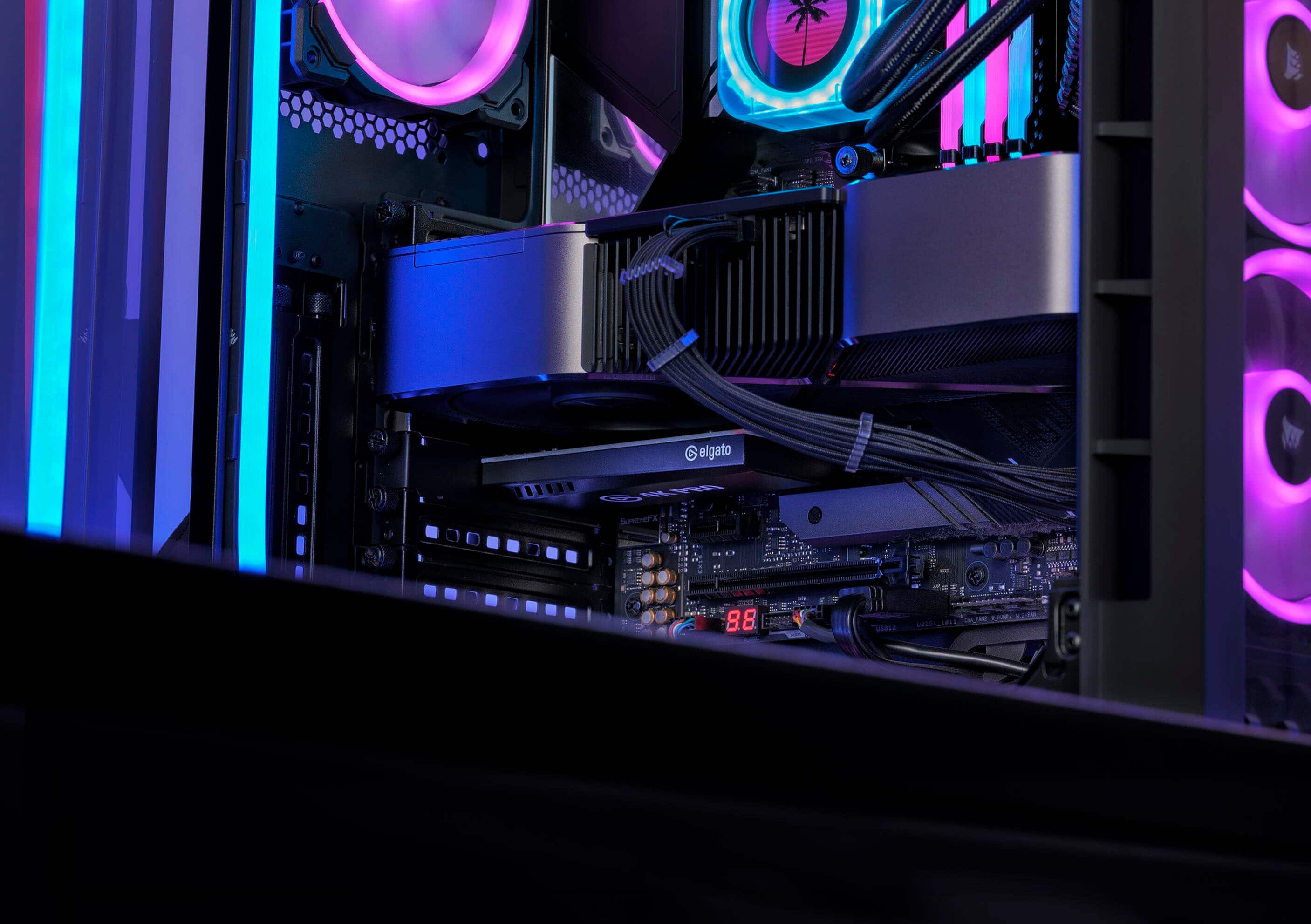 The image features a computer with a large number of fans and a purple light. The computer is sitting on a desk, and the fans are arranged in a way that they are visible from the front and side of the computer. The fans are likely there to cool down the computer and ensure its proper functioning.