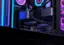 The image features a computer with a large number of fans and a purple light. The computer is sitting on a desk, and the fans are arranged in a way that they are visible from the front and side of the computer. The fans are likely there to cool down the computer and ensure its proper functioning.