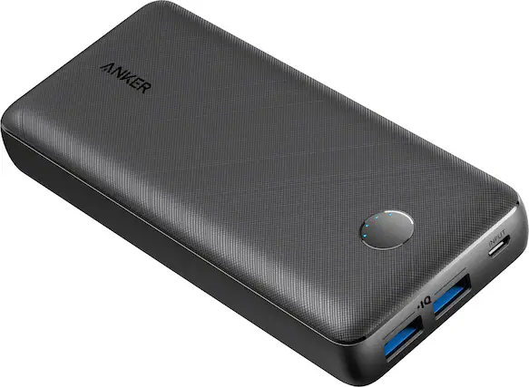 The image features a small, rectangular, gray device with a USB port on the side. The device is an Anker Power Bank, which is designed to charge electronic devices such as smartphones and tablets. The USB port allows users to connect their devices to the power bank and charge them when needed. The power bank is a convenient and portable solution for people who need to charge their devices on the go or in situations where access to a traditional power outlet is limited.