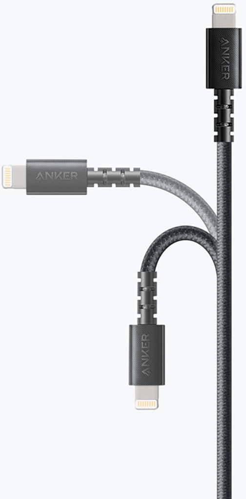 The image features a white background with a black cord and a white plug. The cord is connected to a device, possibly a phone or a laptop, and is plugged into a wall outlet. The cord appears to be a USB cable, which is commonly used for charging or transferring data between devices. The focus of the image is on the cord and the plug, with no other objects or details visible in the background.