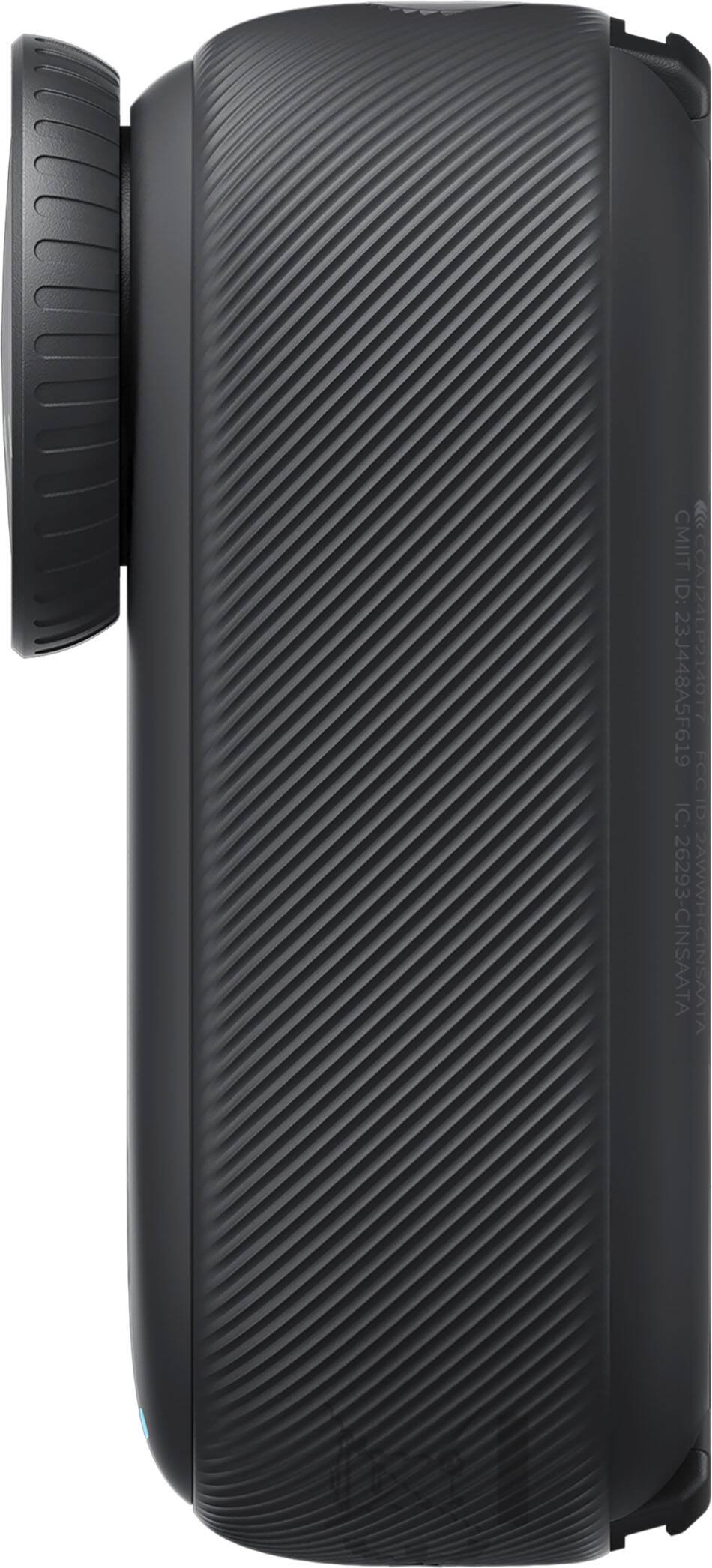 The image shows a black object, possibly a camera or a phone, sitting on a black background. The object has a unique design with a curved shape and a texture that resembles a grip. The close-up view of the object highlights its intricate details and emphasizes its modern and sleek appearance.