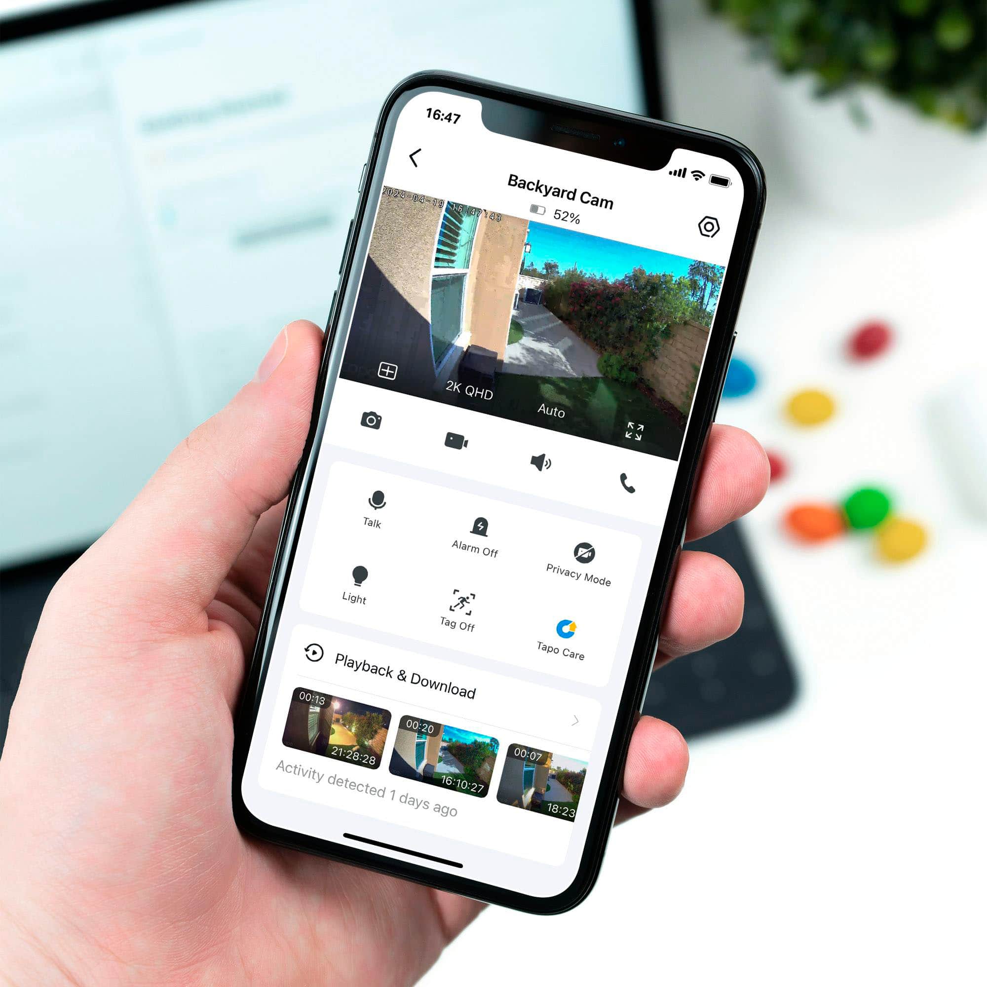 The text on the image reads: "16:47 Backyard Cam ES 52% 2K QHD Auto Talk $ Alarm Of Privacy Mode Light Tag Of Tapo Care Playback & Download 00:13 21:28-28 00:07 Activity 16-10:27 detected 1 days ago 18:23."