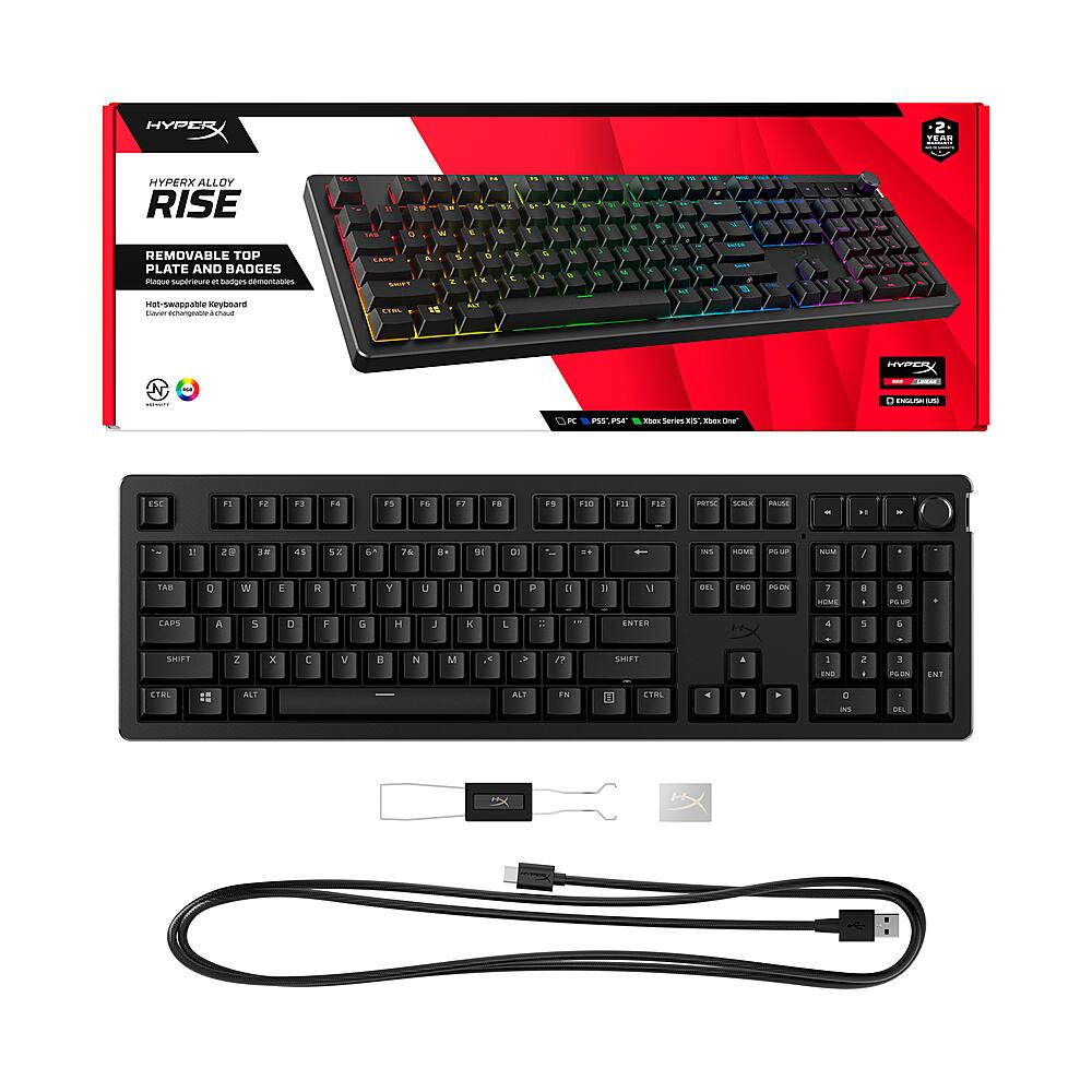 HyperX Rise keyboard with a detachable top plate and badges. The keyboard features a black color scheme and is compatible with Windows and Mac operating systems. It has a wrist rest, a USB cable, and a key puller for easy cleaning. The keyboard is designed for gaming and typing, providing a comfortable and responsive experience for users.