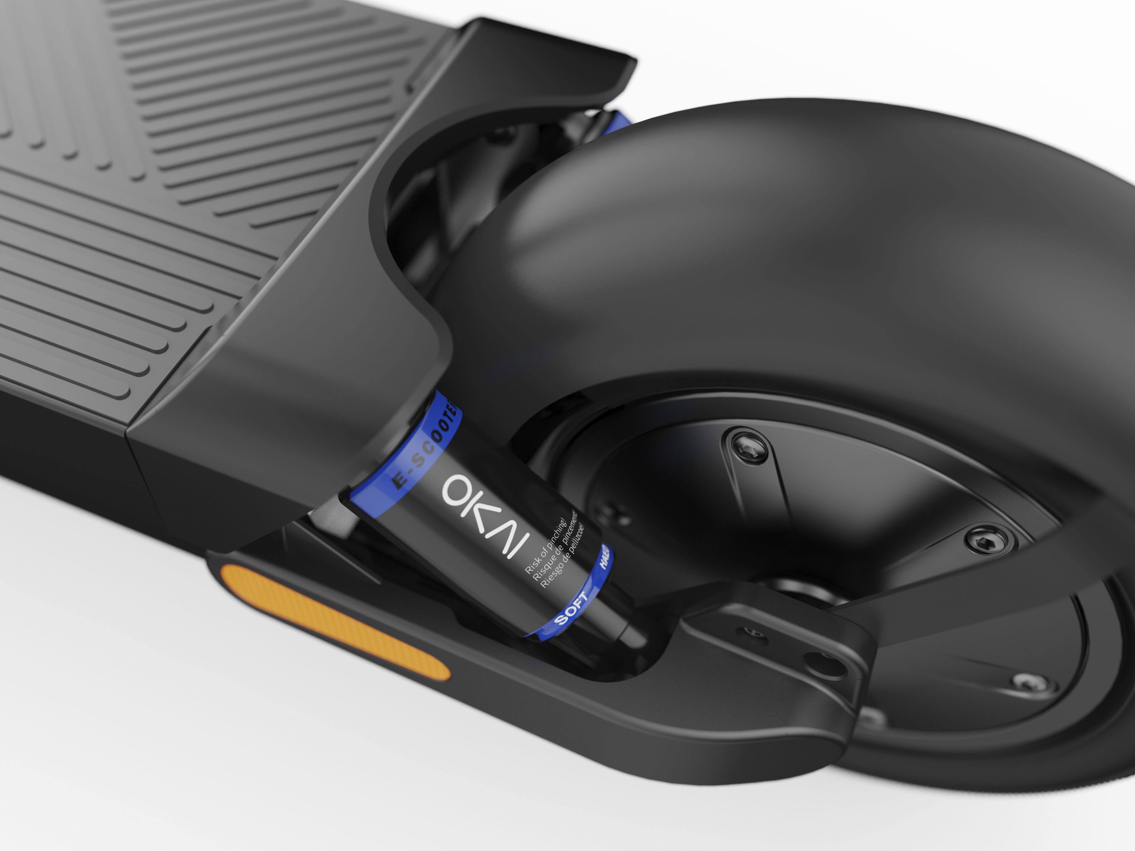 The image features a black scooter with a black seat and a black wheel. The scooter is equipped with a blue and black handle, and it has a black and orange footrest. The scooter is designed by OKI, and it is a pneumatic scooter.