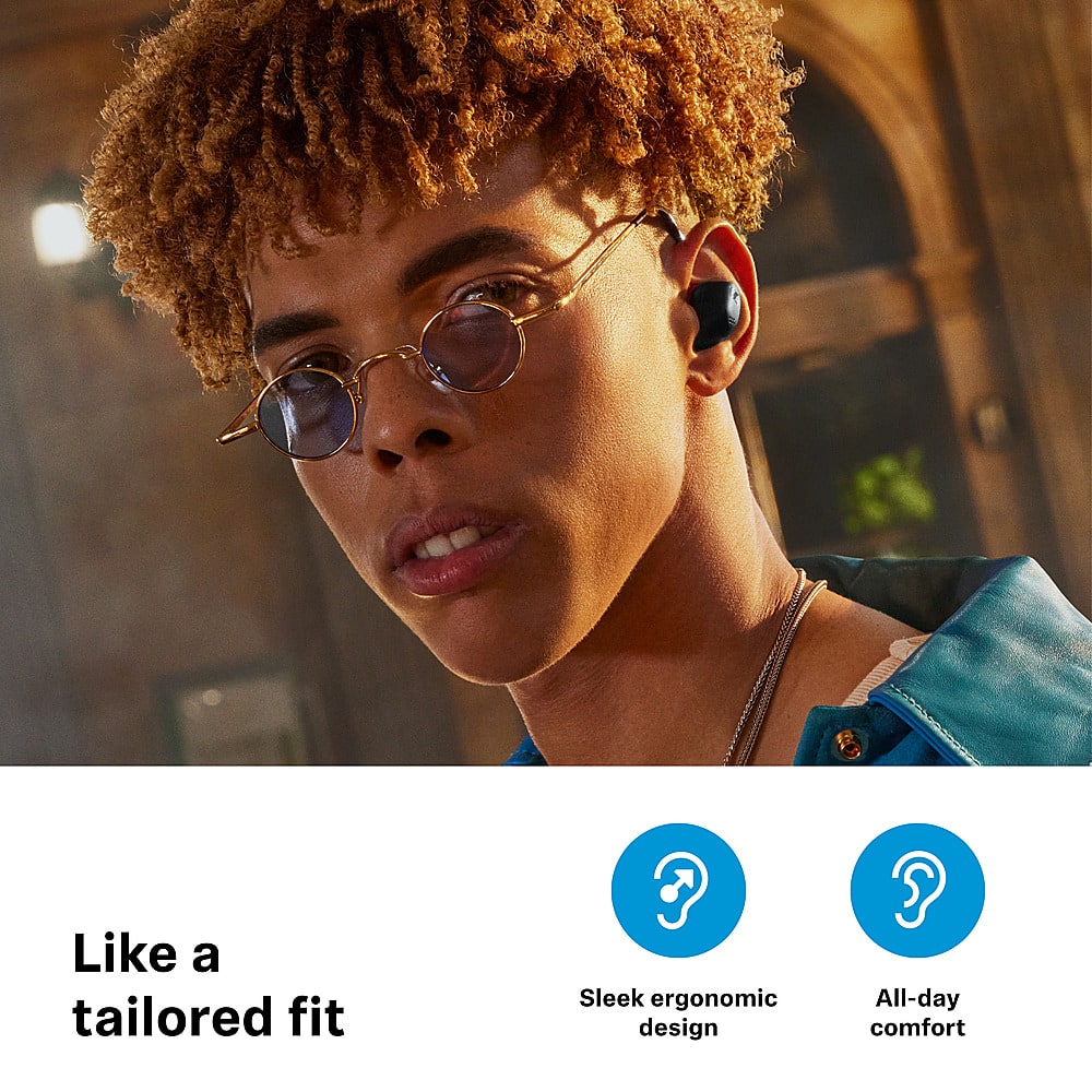The image features a young man wearing glasses and a blue shirt. He is looking at the camera with a smirk on his face. The image is likely promoting a product, as it is described as "Like a tailored fit," "Sleek ergonomic design," and "All-day comfort."