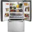 The image features a large refrigerator filled with various food items and drinks. The refrigerator is stocked with a variety of bottles, including juices and other beverages. There are also several bowls containing fruits and vegetables, such as apples and oranges. The refrigerator is well-organized, and the items are easily accessible. The refrigerator is likely used to store fresh produce, beverages, and other food items for a family or household.