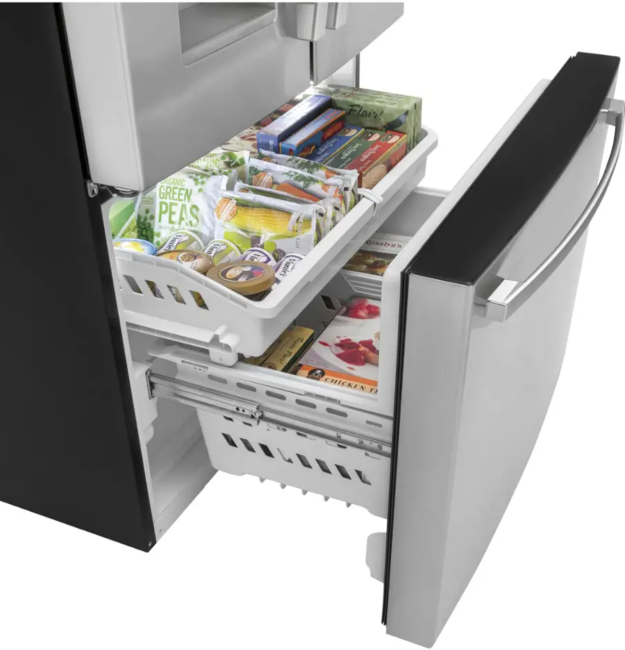 The image shows a refrigerator with its door open, revealing a drawer filled with various food items. The drawer contains a variety of snacks, including multiple bottles, a bowl, and a book. The bottles are placed in different positions within the drawer, while the bowl is located towards the center. The book is situated towards the right side of the drawer. The refrigerator is filled with food, making it a convenient place to store and access snacks.