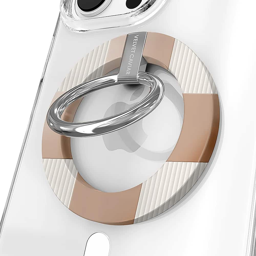 The image features a close-up view of a cell phone with a case on it. The case has a circular design and is made of metal. The case is attached to the cell phone with a ring, which is also made of metal. The ring is located near the top of the cell phone. The case and ring are both made of metal and have a silver color. The case is designed to protect the cell phone and add a touch of style to it.